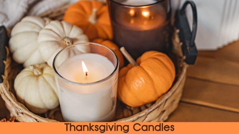 Thanksgiving candles in a bowl with small decorative pumpkins.