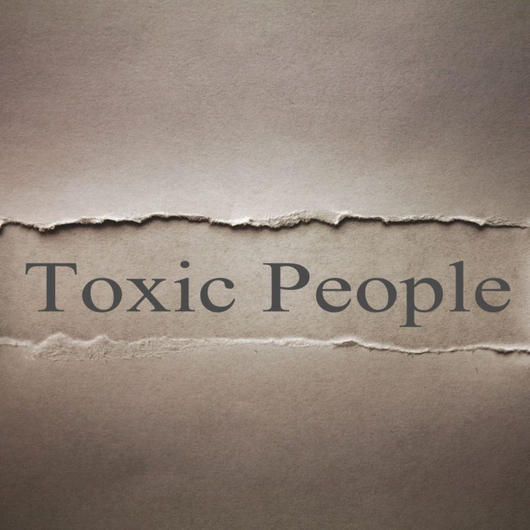 Toxic people written on a piece of old paper.