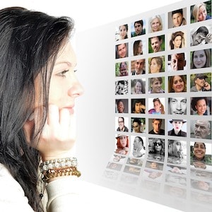 Woman looking at photo array of many generations of people showing how salespeople need to understand each generation