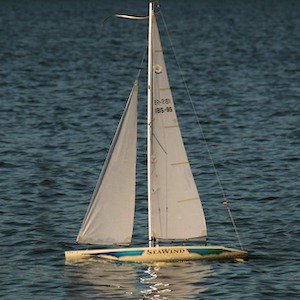 Sail boat in full sail showing how the captain can control the sail but not the wind