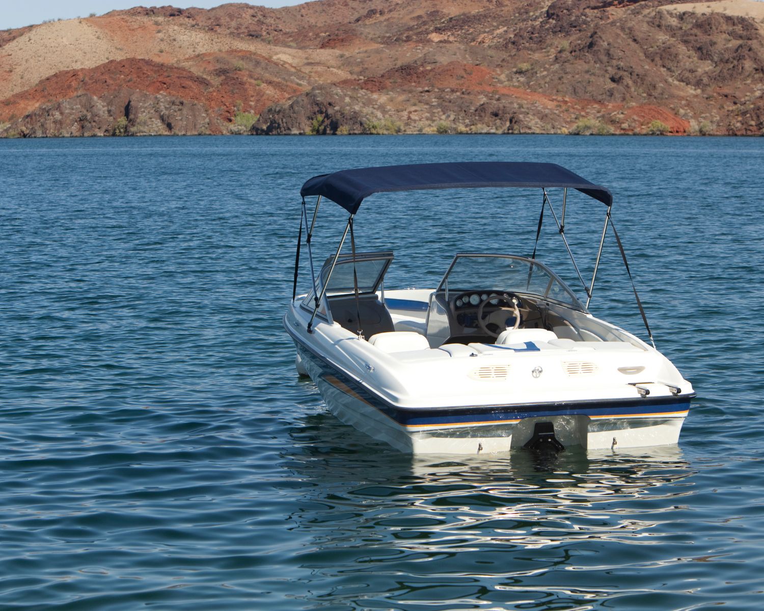 Boat floating on Arizona Lake.