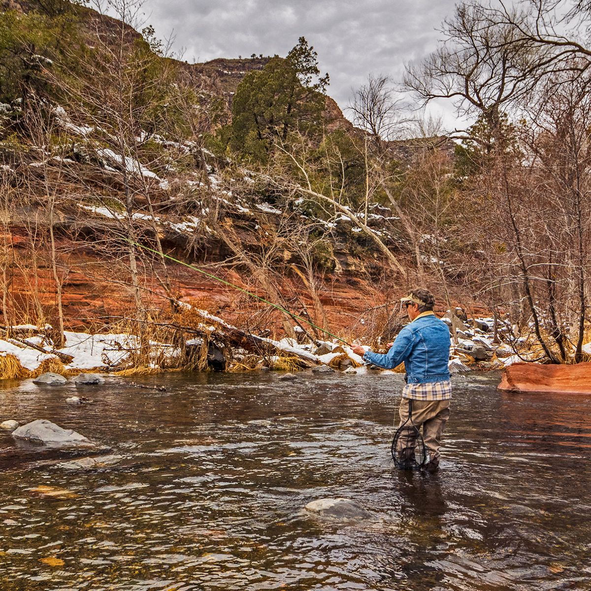 Man Fly-Fishing On Oak Creek Sedona Arizona During Winter.